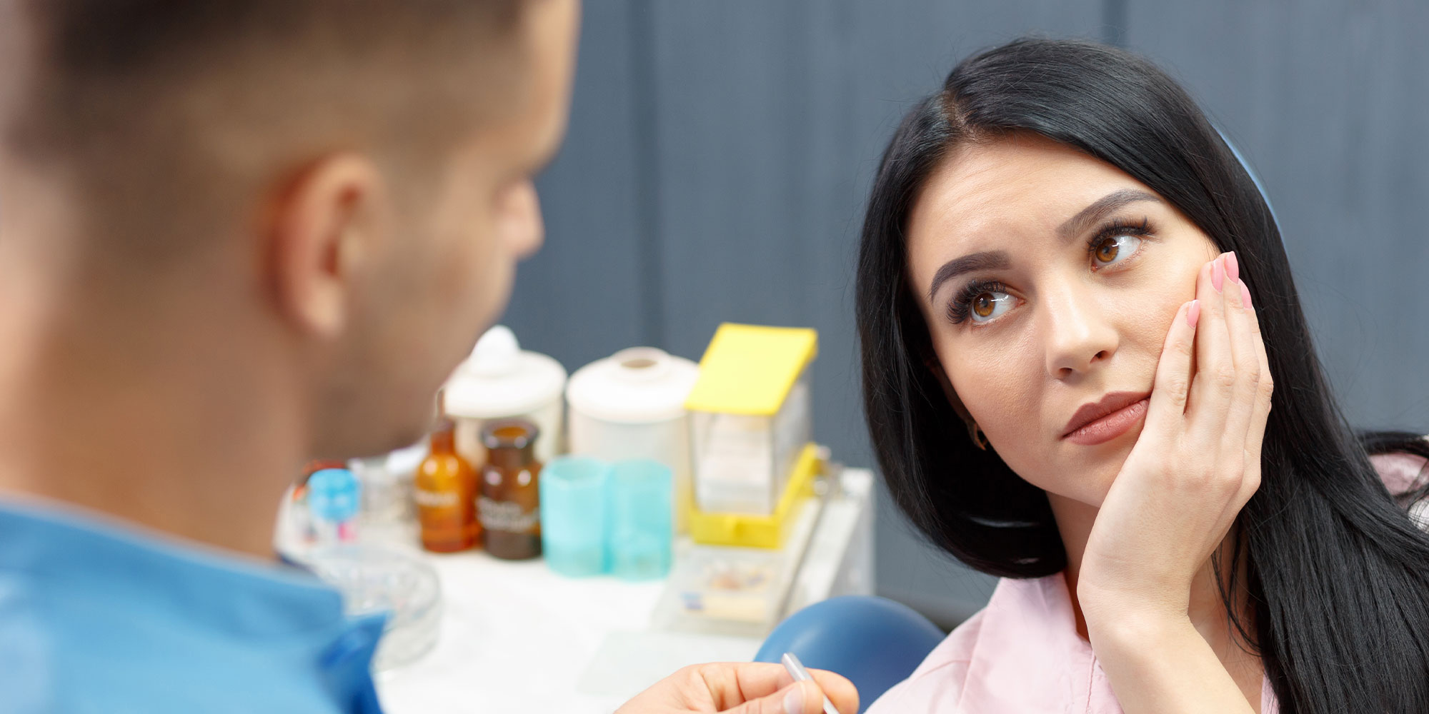 person having mouth pain at the dental clinic