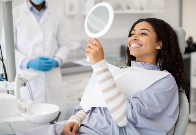 Dentist discussing gum recession treatment options with a patient