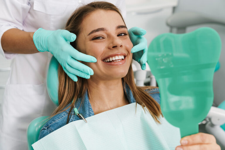 Dentist discussing gum health with a patient in a modern dental office