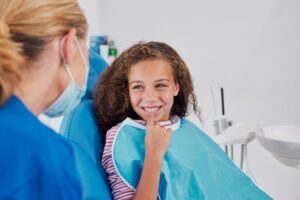 Periodontist consulting with a patient at a dental clinic